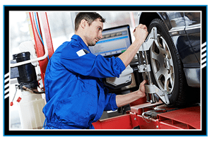 car mechanic installing sensor during suspension adjustment and automobile wheel alignment work at repair service station